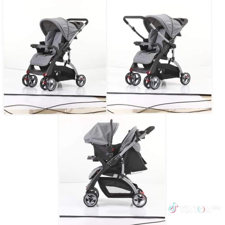 Reversible handle stroller with carrycot cup holder foot rest Reclining position