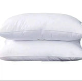 A pair of DFDC compressed comfy pillows