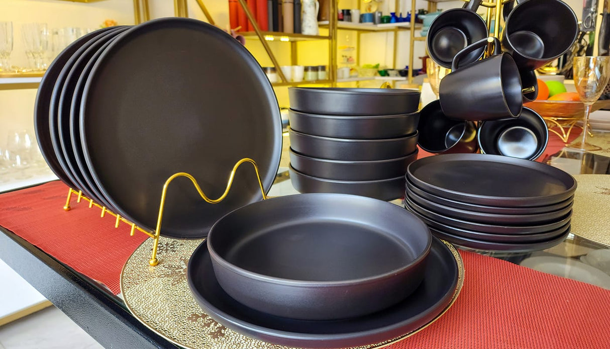 24 Piece Plain black leaf dinner set.